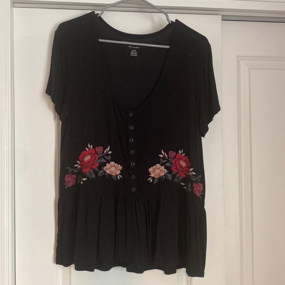 Black peplum top with floral design